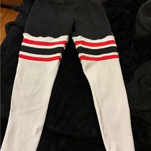 Bombshell Sportswear Black and White Leggings with Red Stripes